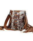 Flouncy- Tan Cowhide with Fringe and Concho Detail